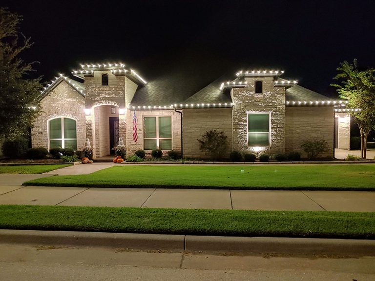 Outdoor Christmas lights installed on a brick house in Waco TX