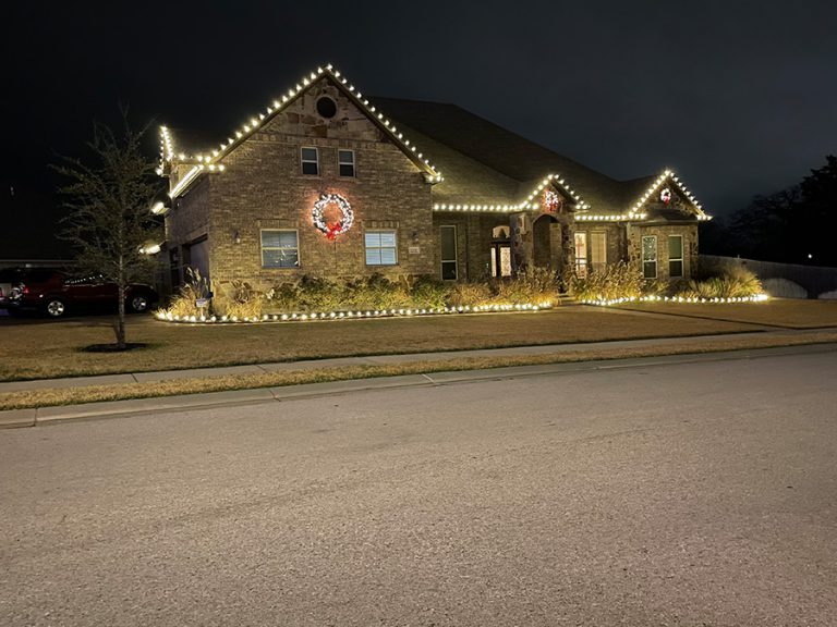 Cedar Park Texas House with outdoor Christmas lights and a wreath.