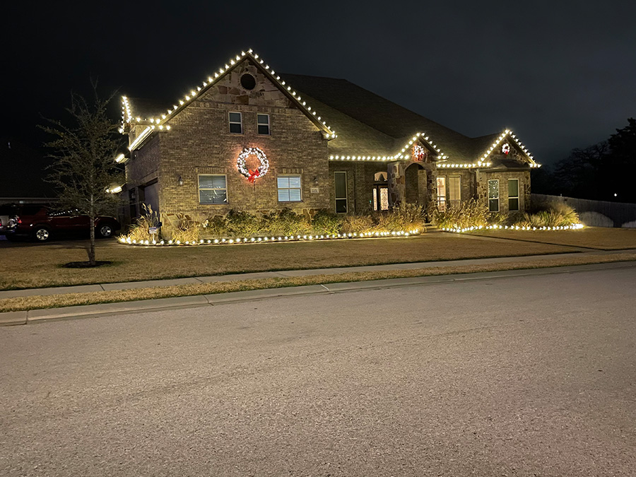 Cedar Park Texas House with outdoor Christmas lights and a wreath.