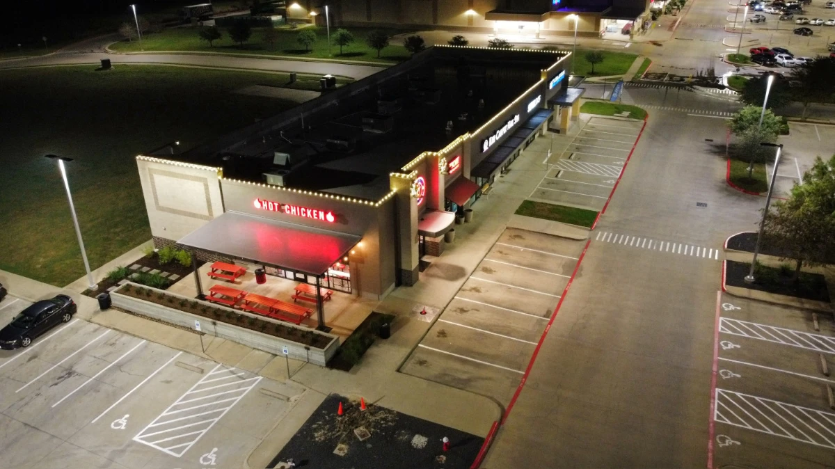shopping center roof lined with Christmas lights