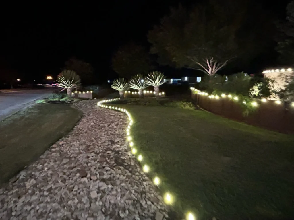 Business lawn and path lined with holiday lights